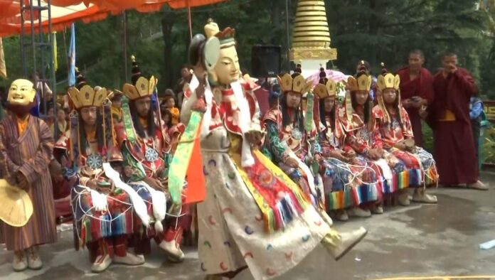 Tibetan Buddhist monks perform traditional Lama Dance on Guru Padmasambhava's birthday