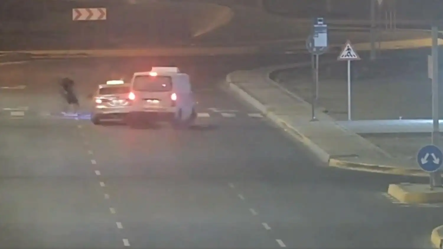 The footage shows the mini van approaching the crossing where the taxi had already stopped, its hazard lights flashing to signal a halt